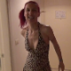A Russian woman with red dyed hair rushes into a hotel room and takes a massive dump on the shower floor. About 2 minutes.